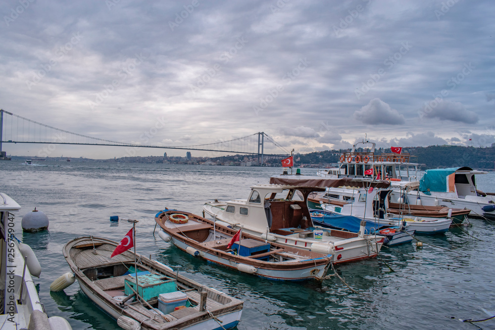 Fishing boats,seagulls, Bosphorus bridge and Marmara sea. Sunset in the Bosphorus and Fatih Sultan Mehmet bridge and throat view