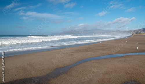 Wave sea water overflowing into Santa Clara river mouth estuary in Ventiura California United States