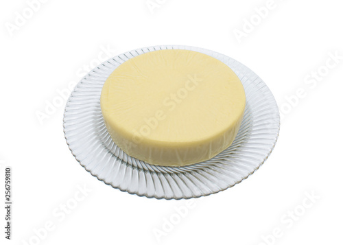 transparent dish on a round format cheese on a white background