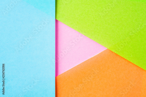 blue and pink paper with play button shape