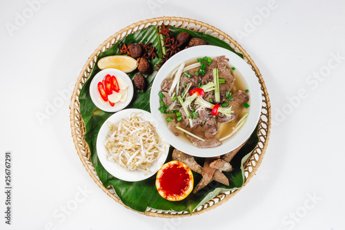 Traditional oriental cuisine of  Vietnam. Pho bo soup with rice noodles  beef  pepper  wheat germ  greens
