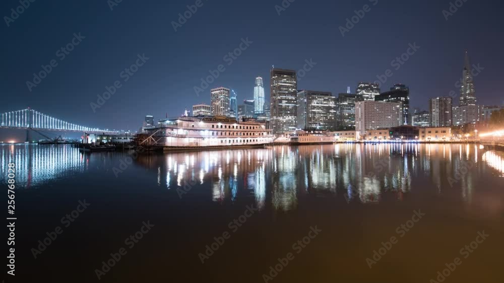 San Francisco Skyline and Bay Bridge Reflections on Ocean at Pier 7 San Francisco Skyline and Bay Bridge Reflections on Ocean at Pier 7