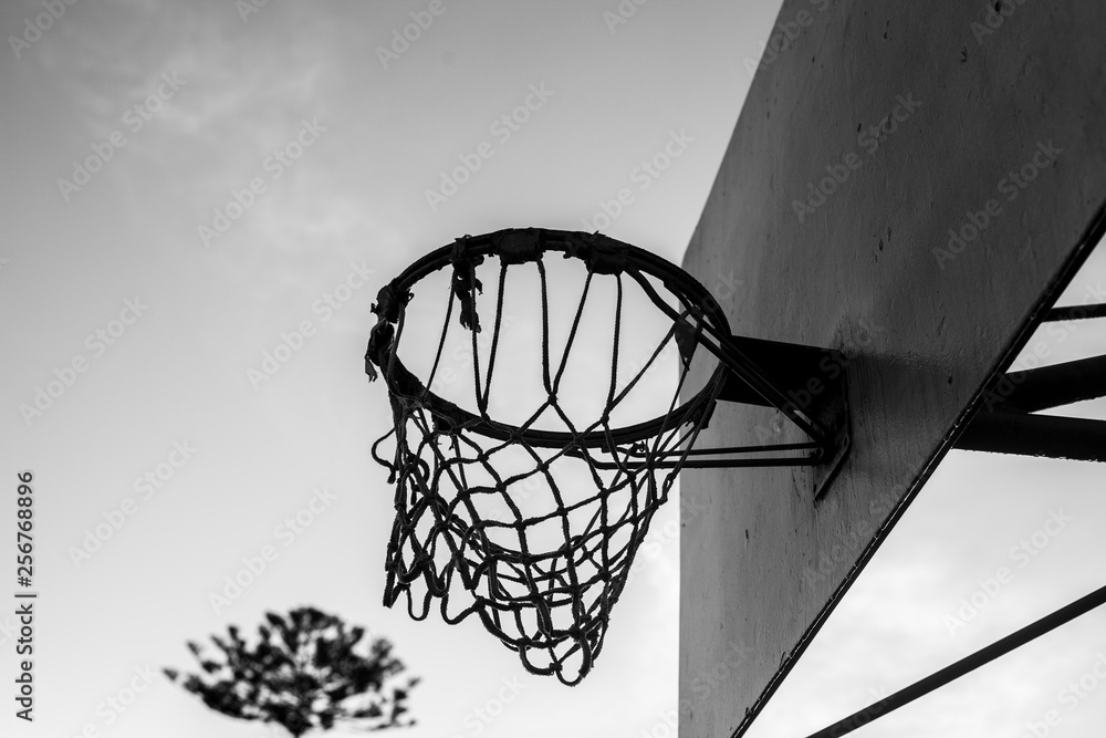 basketball hoop taken at sunrise