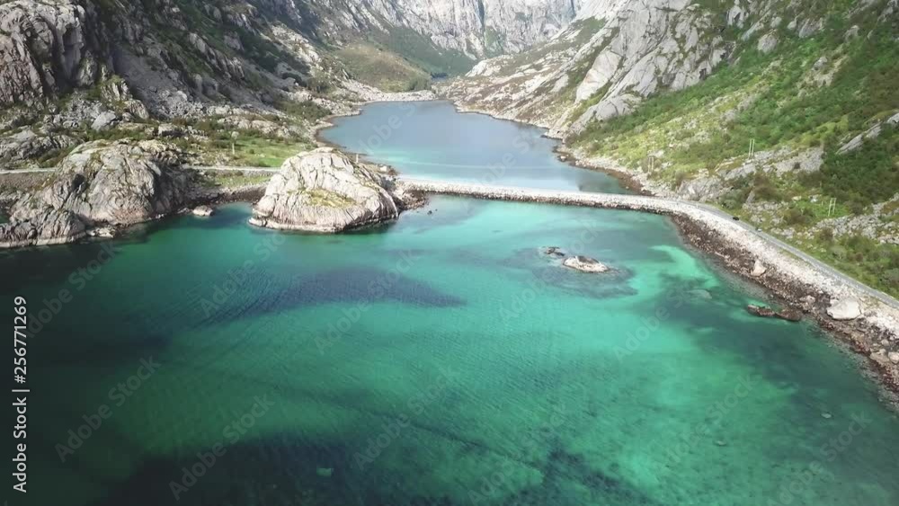 Forward approaching drone shot over the sea with rocky cliffs in the background. 4k video quality in Lofoten, Norway Forward approaching drone shot over the sea with rocky cliffs in the background. 4k video quality in Lofoten, Norway