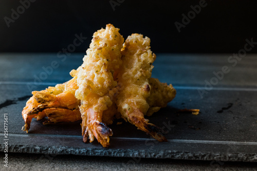 Shrimp Tempura with Soy Sauce on Black  Stone Board. photo