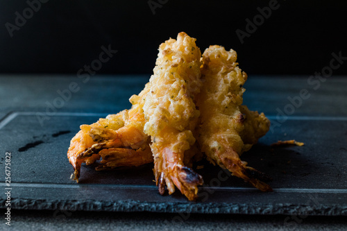 Shrimp Tempura with Soy Sauce on Black Stone Board.