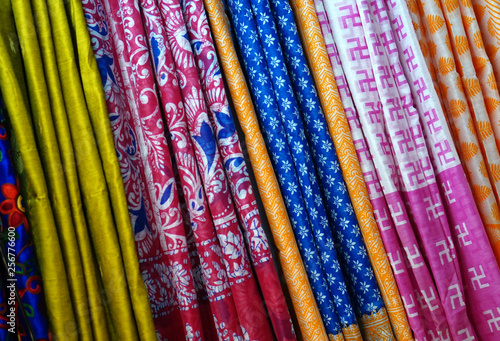 View of Indian woman dress sarees or saris hung as display in a retail store