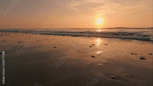 Vesterhavet in Denmark with a beautiful sunset. Calm waves. photo