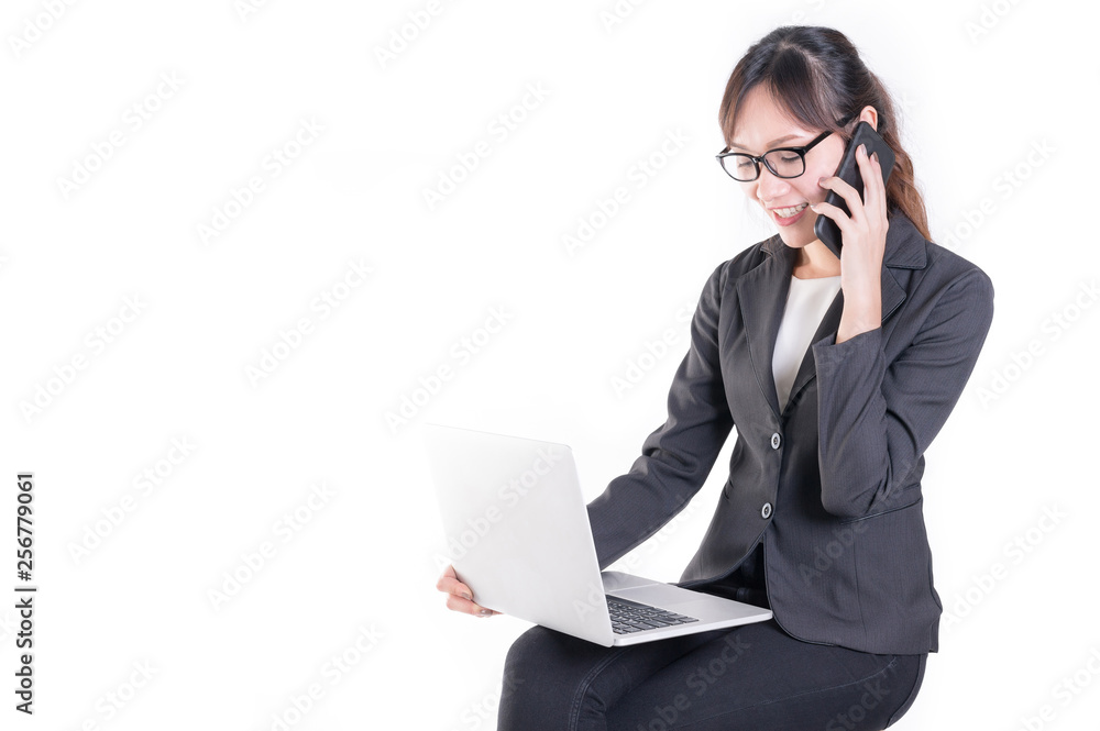 Young businesswoman use smartphone and computer laptop discuss about job. Young businesswoman use smartphone and computer laptop discuss about job.