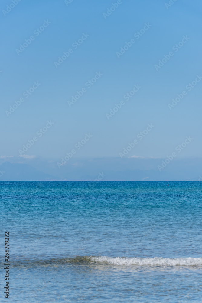 Clear Turquoise Blue Water at a Southern Mediterranean Beach in Italy Clear Turquoise Blue Water at a Southern Mediterranean Beach in Italy