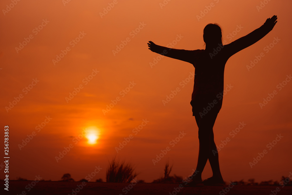 Happy woman on the sunset in nature in summer with open hands - Image