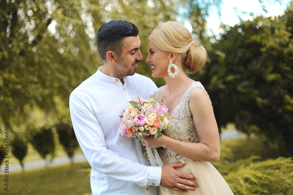 Portrait of wedding couple, stylish bride and groom in park Portrait of wedding couple, stylish bride and groom in park
