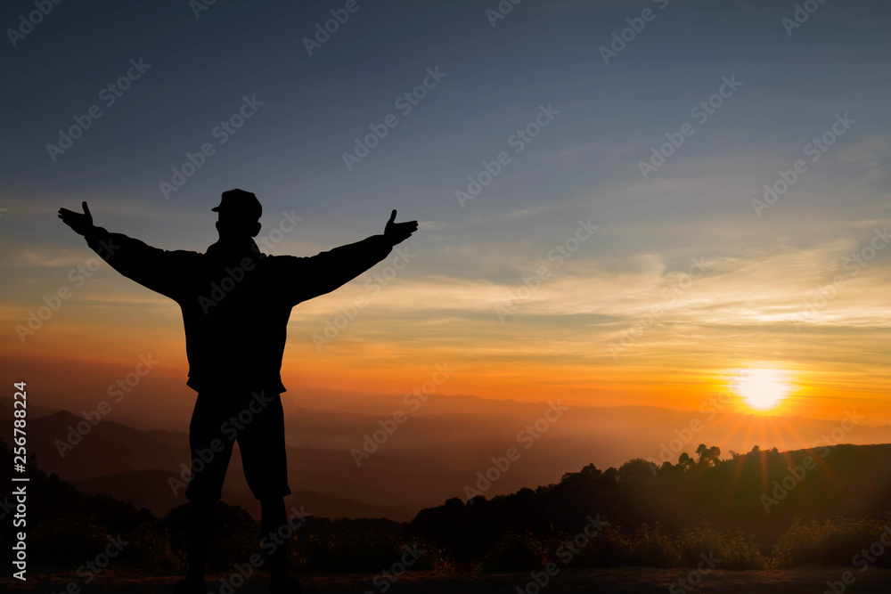 Silhouette of young man standing on the mountain with hands raised up on sunrise background, successful, achievement and winning concept vector illustration Silhouette of young man standing on the mountain with hands raised up on sunrise background, successful, achievement and winning concept vector illustration
