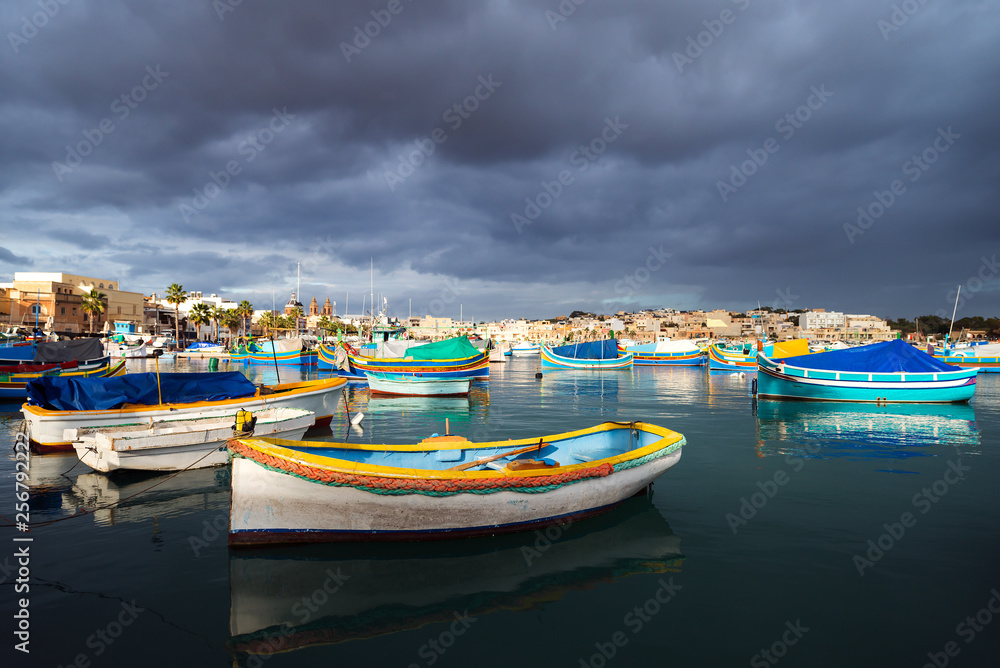 Gloomy sky over fisher village Marsaxlokk, Malta