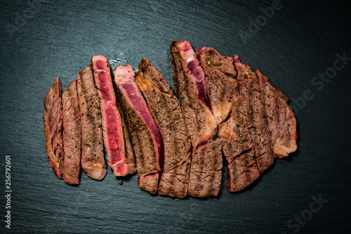 Grilled flat iron steak shot in flat lay style