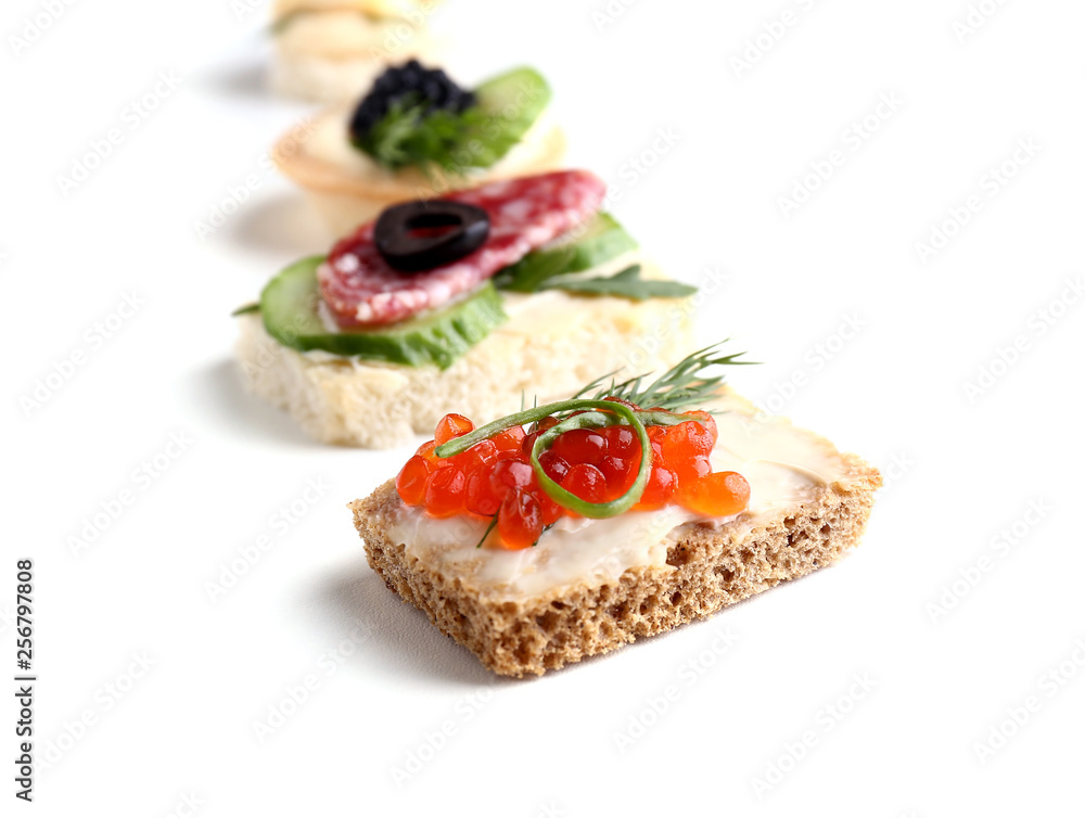 Assortment of tasty canapes on white background Assortment of tasty canapes on white background