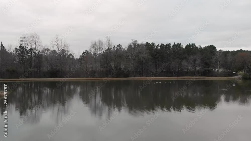 flying over pond and baseball fields flying over pond and baseball fields