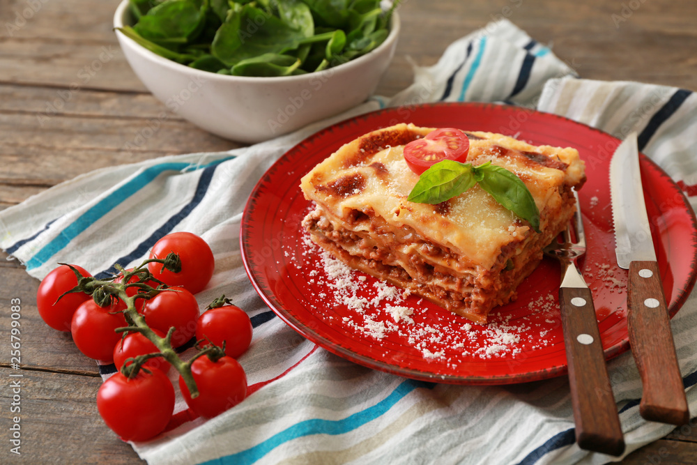 Tasty baked lasagna on wooden table Tasty baked lasagna on wooden table