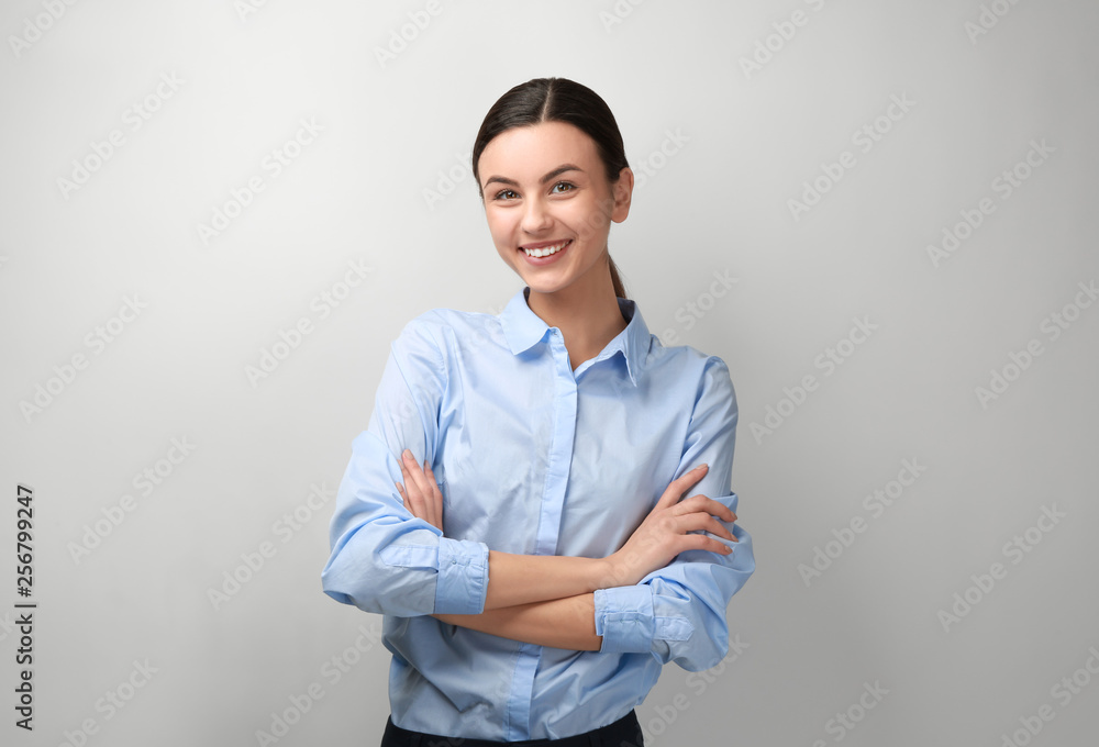 Portrait of beautiful businesswoman on light background Portrait of beautiful businesswoman on light background
