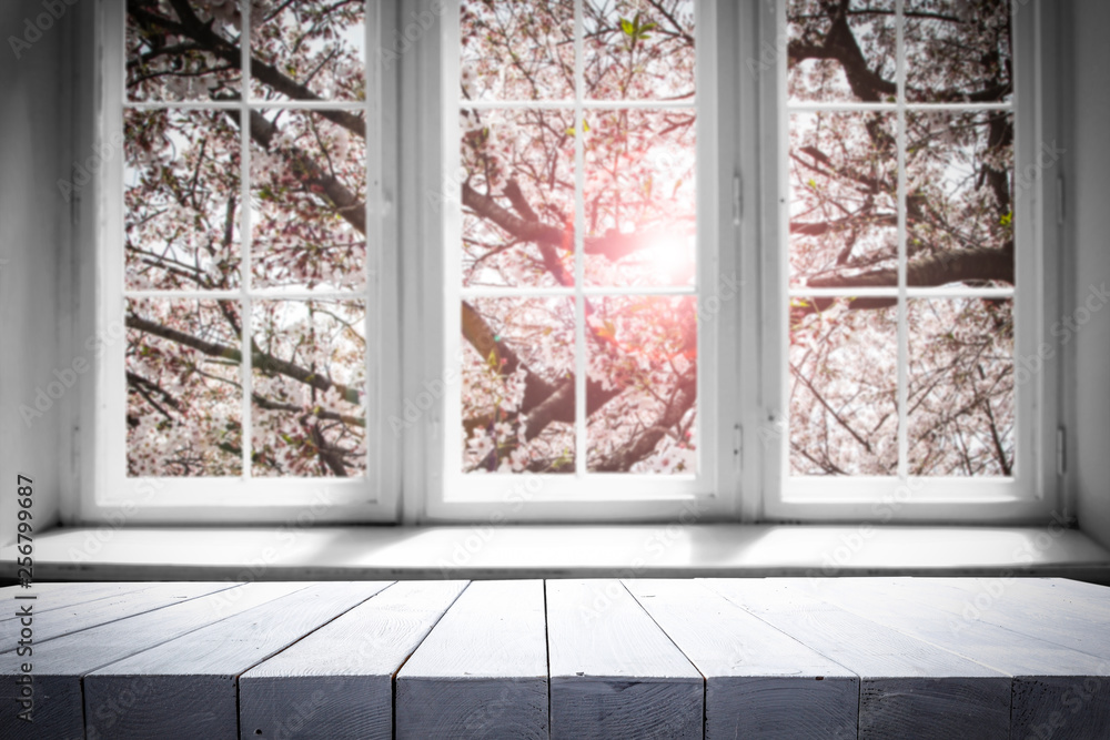 Obraz premium Desk of free space and spring window background 