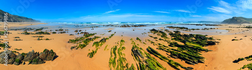 Rock formations on sandy beach (Portugal).