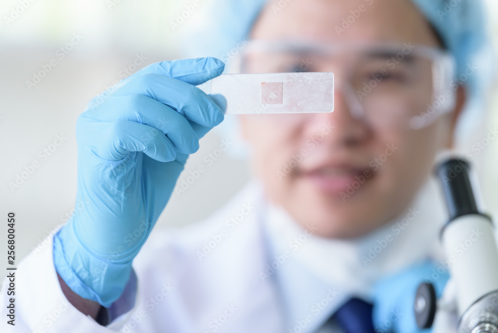 Asian man scientist researching and learning in a laboratory. Asian man scientist researching and learning in a laboratory.