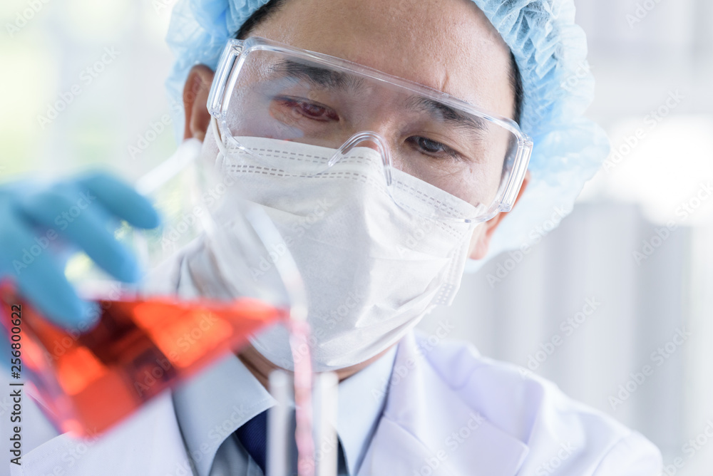 Asian man scientist researching and learning in a laboratory. Asian man scientist researching and learning in a laboratory.