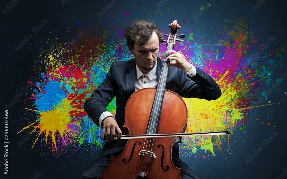 Fototapeta premium Young classical musician with colorful splotch wallpaper 
