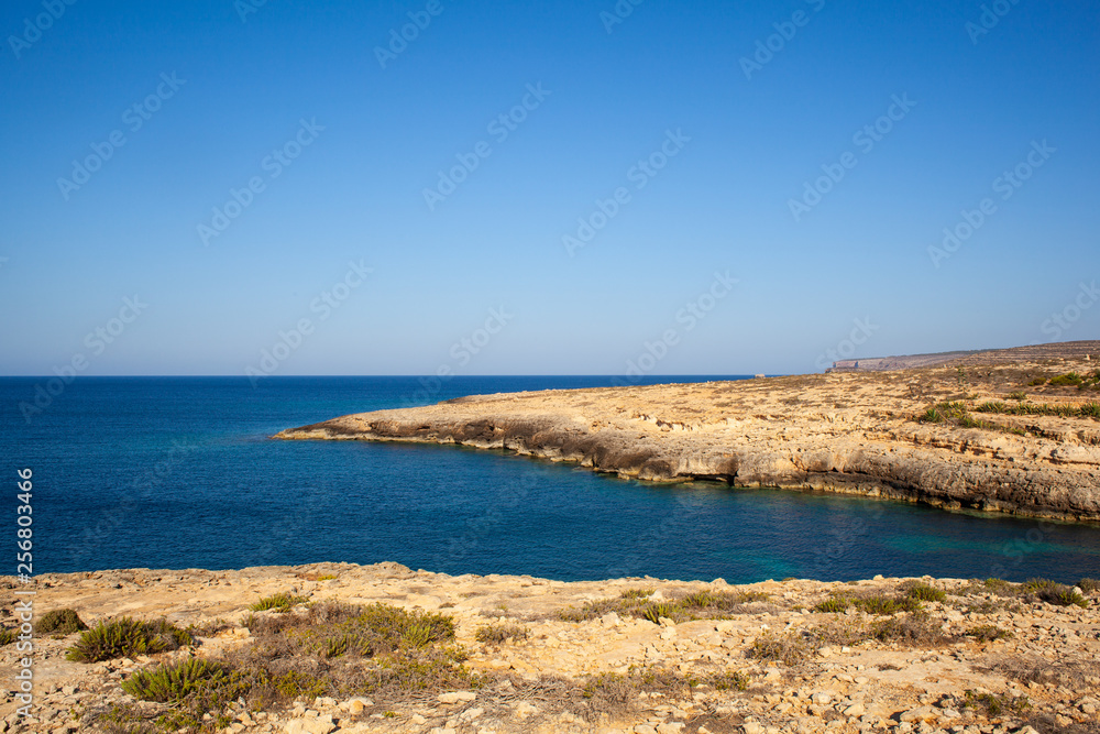 View of Cala Greca in the summer season