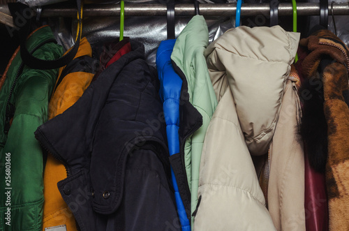 men's and women's clothing on a hanger in the closet