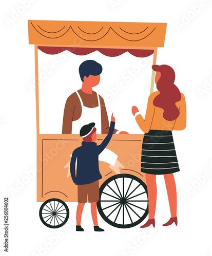 Street food cart mother and son buying snack from trolley