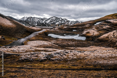 Landscape of Landmannalaugar surreal nature scenery in highland of Iceland, Nordic, Europe. Beautiful colorful snow mountain terrain famous for summer trekking adventure and outdoor walking. photo