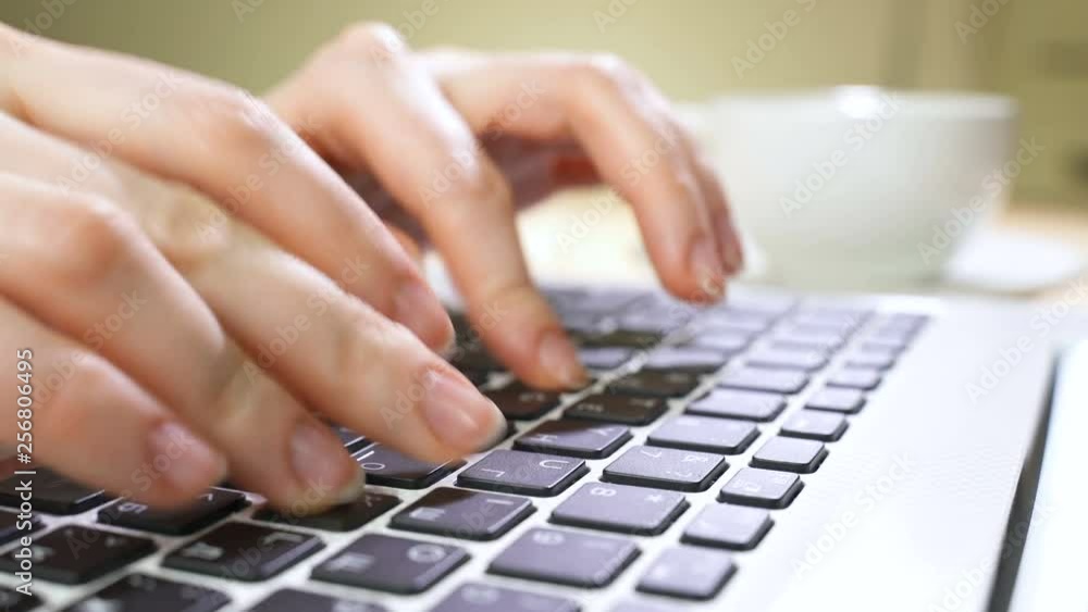 Laptop keyboard typing. Close up shot of hands touch typing on a laptop keyboard Laptop keyboard typing. Close up shot of hands touch typing on a laptop keyboard