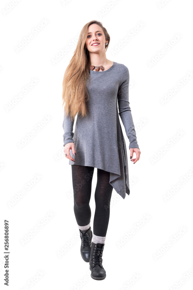 Happy confident young woman in stylish hipster clothes walking. Full body isolated on white background. Happy confident young woman in stylish hipster clothes walking. Full body isolated on white background.