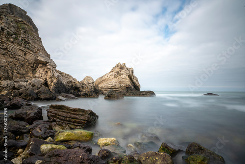 Black sea and the beach with rocks and waves with cloudy sky,  © nesrin