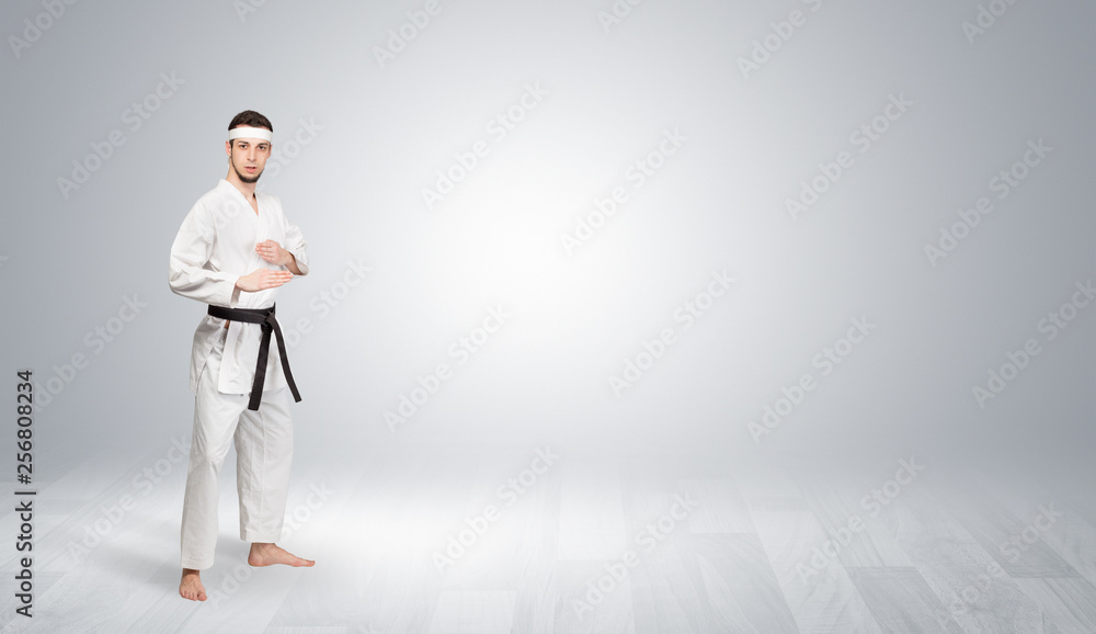 Young kung-fu trainer fighting in an empty space
Young kung-fu trainer fighting in an empty space