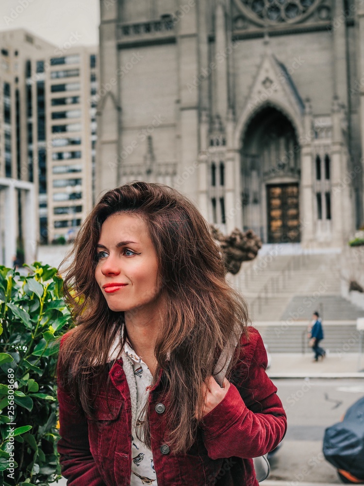 Girl with long hair sitting near grace Cathedral in San Francisco Girl with long hair sitting near grace Cathedral in San Francisco
