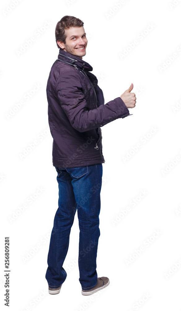 Back view of man in parka thumbs up. Back view of man in parka thumbs up.