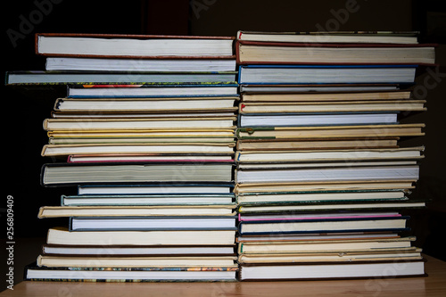 stack of books in a multi-colored cover  close-up