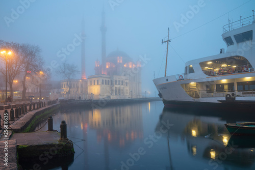 Foggy day, Ortaköy Mosque and Passenger Ferry in Istanbul, Turkey.  © nesrin