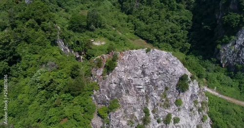 Drone shot of forest around limestone hills at Batu Caves, Malaysia. photo