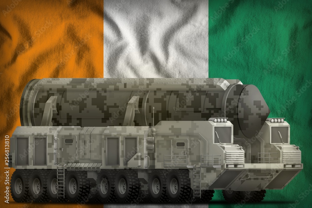 intercontinental ballistic missile with city camouflage on the Cote d Ivoire national flag background. 3d Illustration