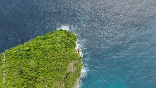 Mavic Pro 2 drone footage of the ocean connecting to the tip of KlingKing Beach in Nusa Penida, Bali, Indonesia. photo