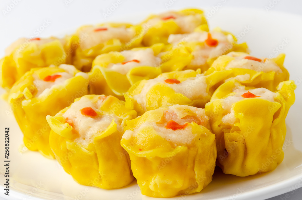 Chinese steamed shrimp dumplings on white dish Chinese steamed shrimp dumplings on white dish