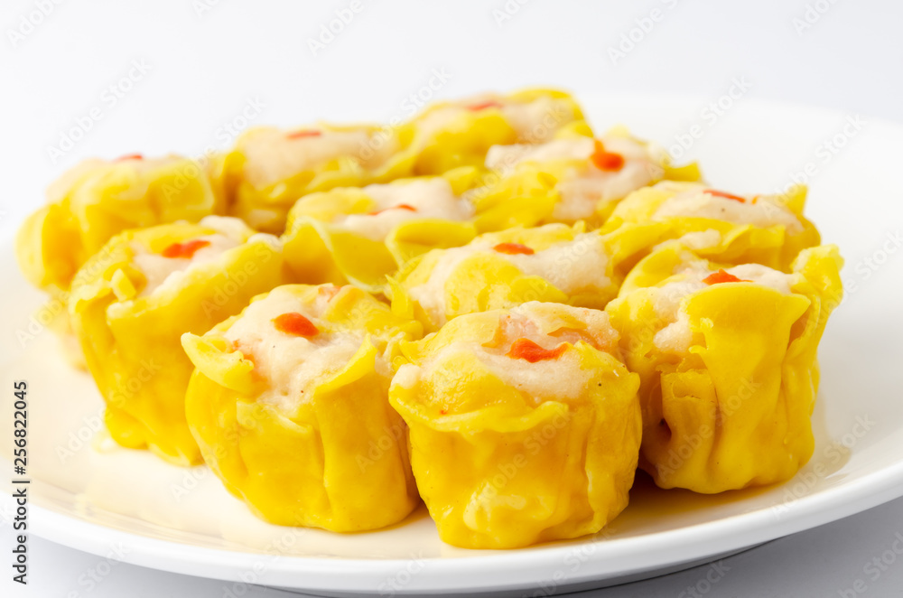 Chinese steamed shrimp dumplings on white dish Chinese steamed shrimp dumplings on white dish