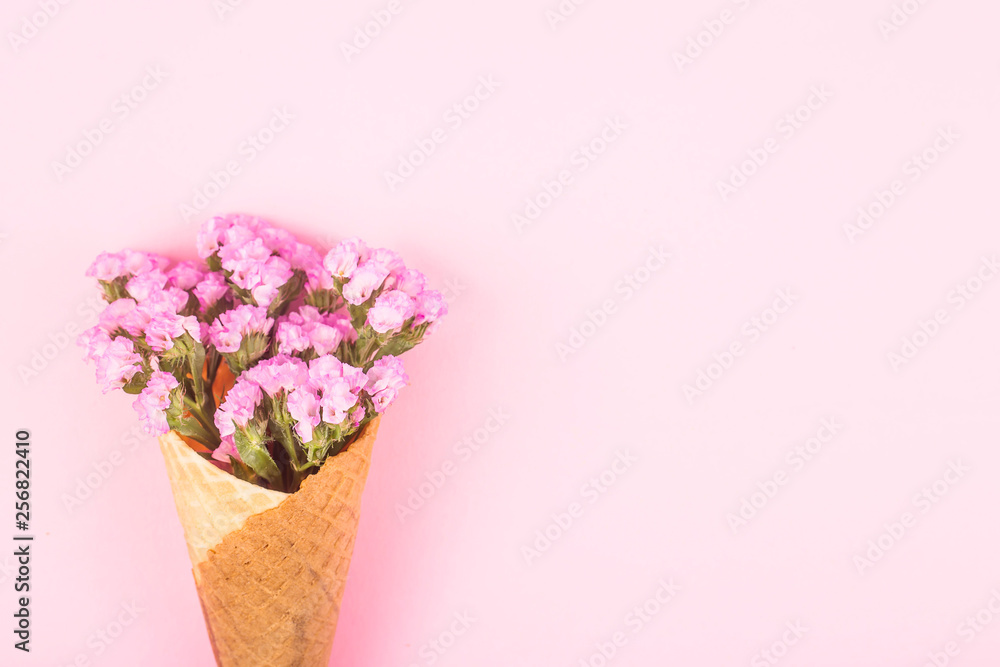 Spring pink and yellow flowers on a pink gentle background. Top view, flat lay, copy space Spring pink and yellow flowers on a pink gentle background. Top view, flat lay, copy space