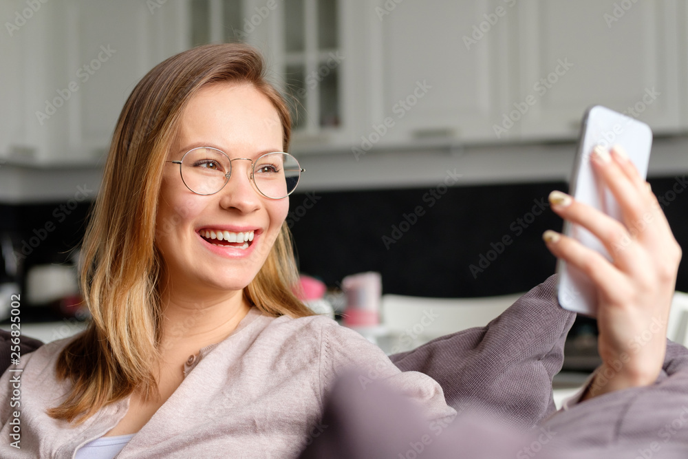 Beautiful young girl talking on the video on the phone. Beautiful young girl talking on the video on the phone.