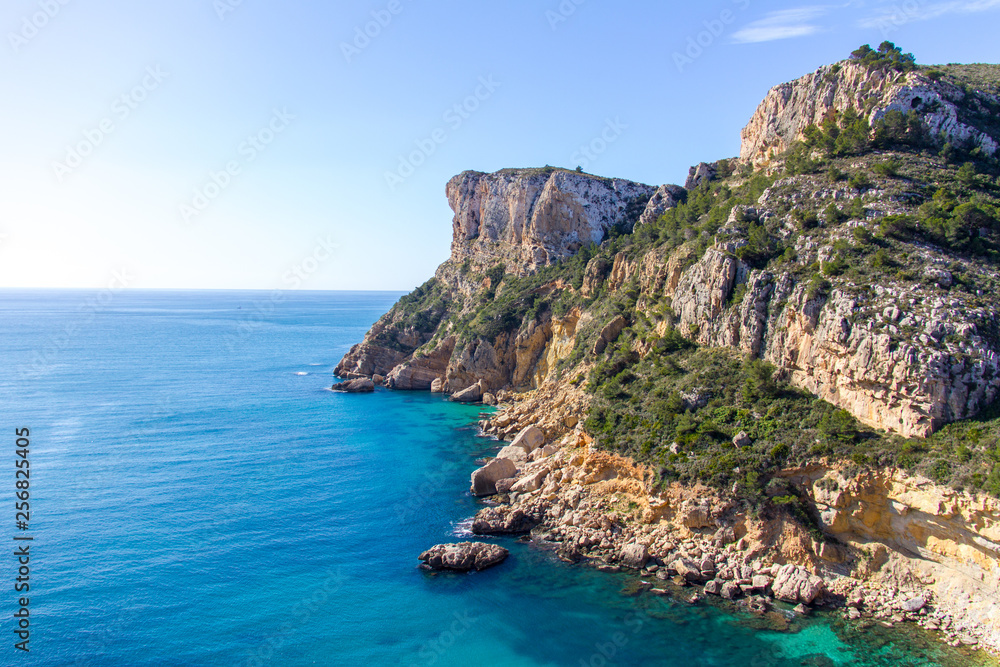 Cliffs in Llevant cove beach in Benitatxell, Alicante, Spain