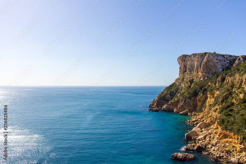 Cliffs in Llevant cove beach in Benitatxell, Alicante, Spain