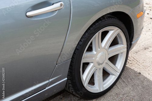 Sporty car wheel rear view of grey sport car